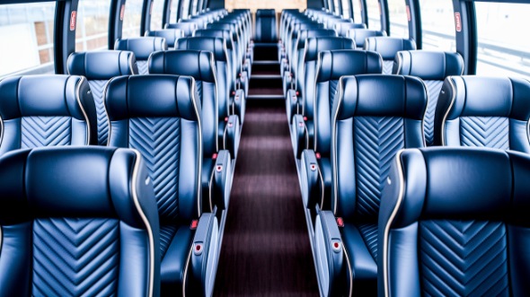 lansing 54 passenger charter bus rental